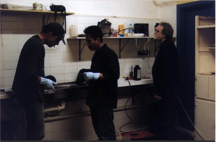 Peter Mudie working with Buwantaro and Albie Thoms, processing 16mm film – photo by Martin Heine, 1999.