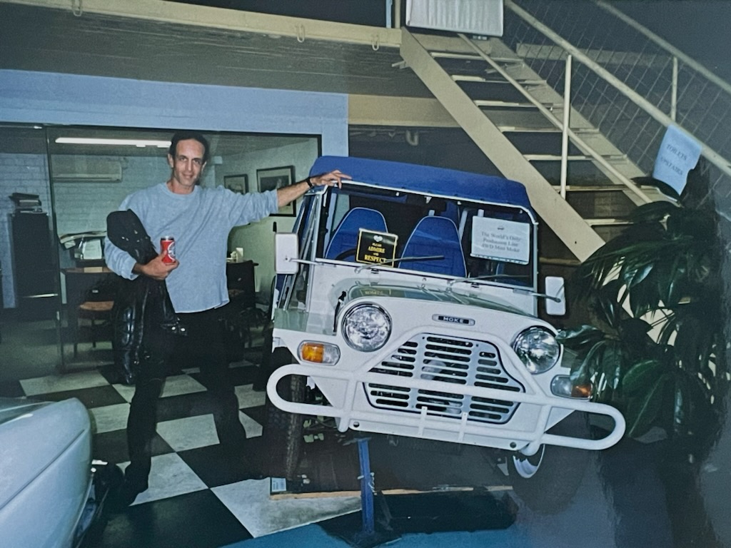 Peter Mudie with Mini Moke