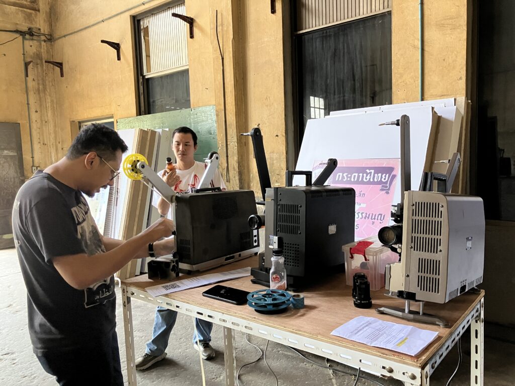 Photo of three 16mm projectors on a table